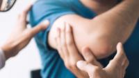 doctor checking patient's arm